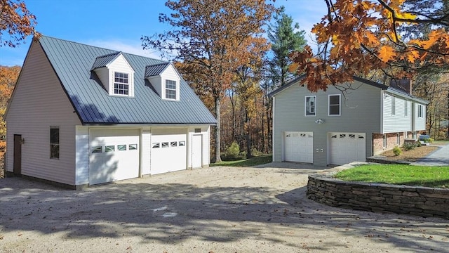 531 Old N Rd, Worthington, MA 01098 - view of side of home with a garage and metal roof