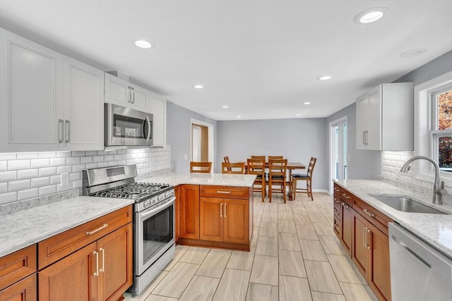 531 Old N Rd, Worthington, MA 01098 - kitchen with stainless steel appliances, a sink, light stone countertops, recessed lighting, and decorative backsplash
