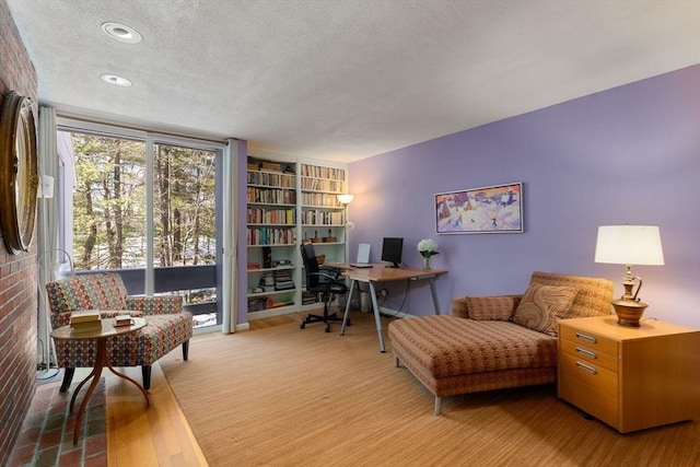 office space featuring a textured ceiling and wood finished floors