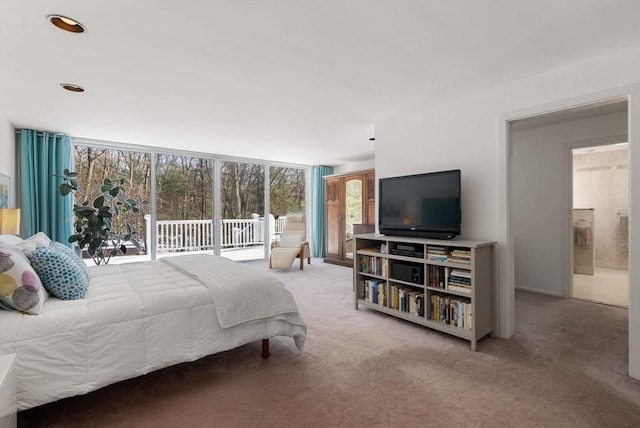 carpeted bedroom featuring access to outside