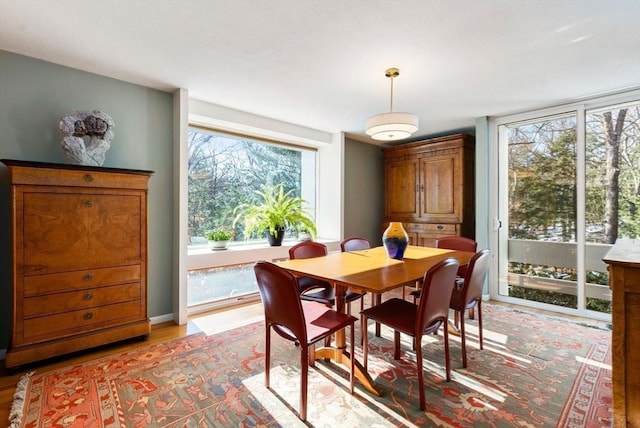 dining space with light wood-type flooring