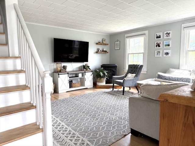 12 Wellington St, Buckland, MA 01370 - living room featuring healthy amount of natural light, stairway, wood finished floors, and crown molding