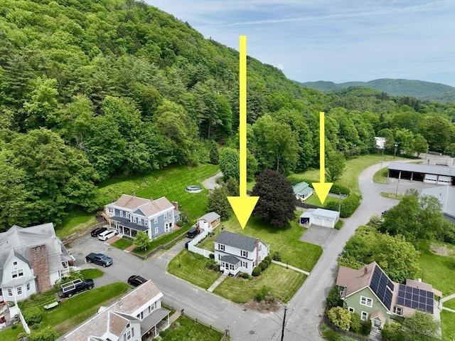 12 Wellington St, Buckland, MA 01370 - aerial overview of property's location with a heavily wooded area and property boundaries highlighted