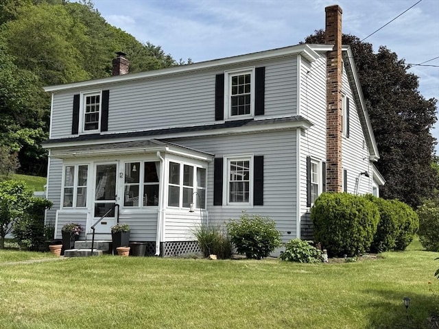 12 Wellington St, Buckland, MA 01370 - view of front of property with a chimney, entry steps, and a front yard