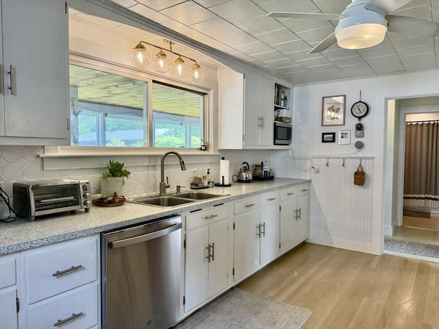 12 Wellington St, Buckland, MA 01370 - kitchen with stainless steel appliances, a sink, light wood-style flooring, light countertops, and white cabinets