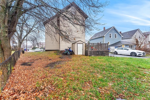 view of yard with fence and a deck