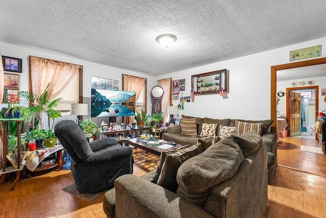 living area featuring a textured ceiling