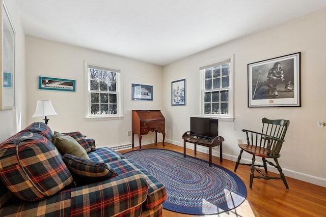 sitting room featuring wood finished floors and baseboards