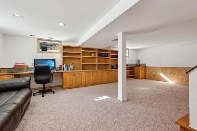 office area featuring recessed lighting, wainscoting, light carpet, and wooden walls