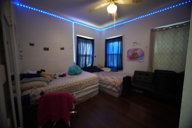 bedroom featuring wood finished floors and a ceiling fan