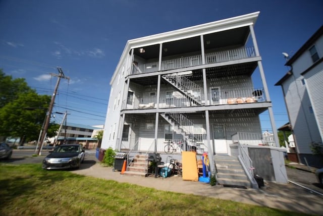 view of front of property featuring stairs