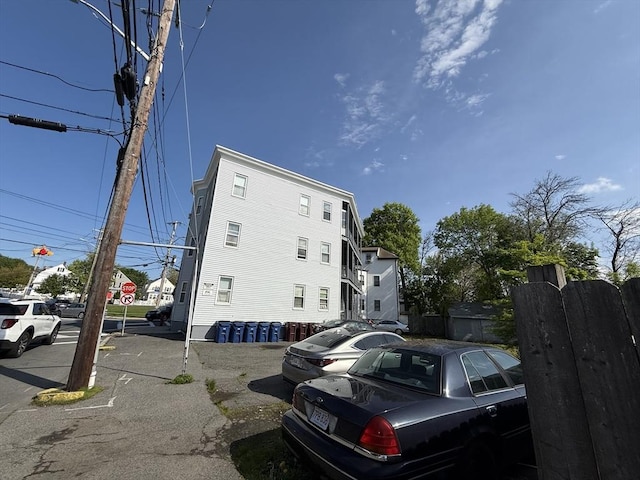 view of property with uncovered parking