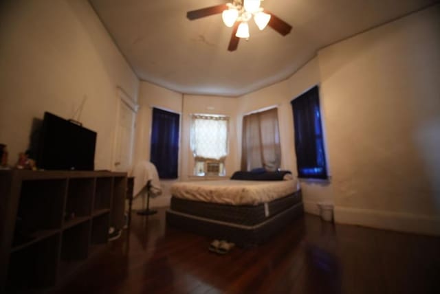 bedroom with wood finished floors