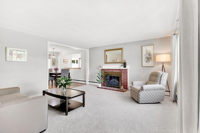 carpeted living area with baseboard heating, a brick fireplace, and a textured ceiling
