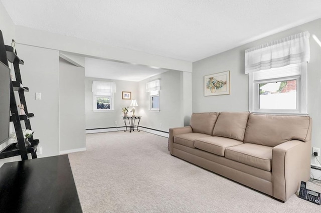 living area featuring carpet, a baseboard radiator, and baseboards