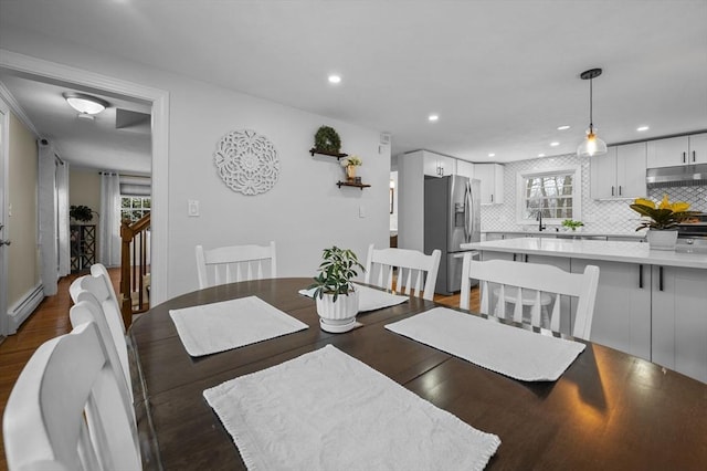 dining area featuring dark hardwood / wood-style floors and baseboard heating