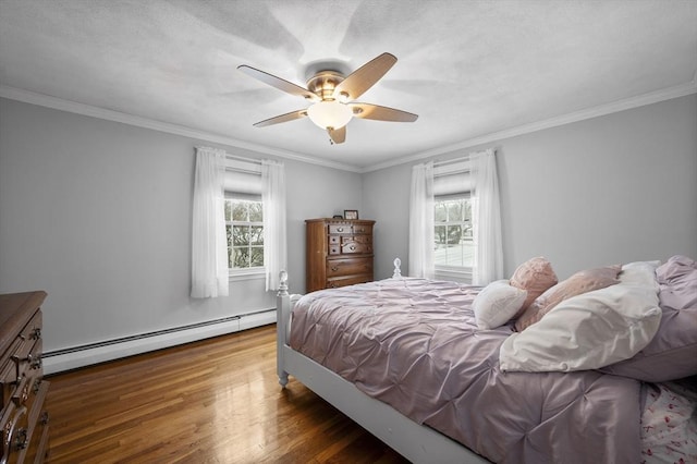 bedroom featuring multiple windows, crown molding, a baseboard radiator, and dark hardwood / wood-style floors