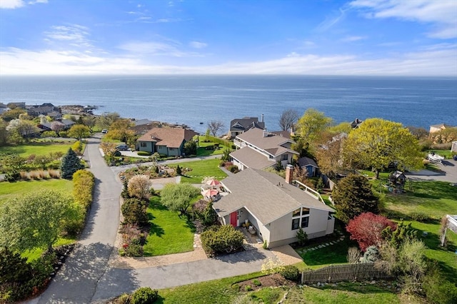 aerial view of residential area featuring a nearby body of water