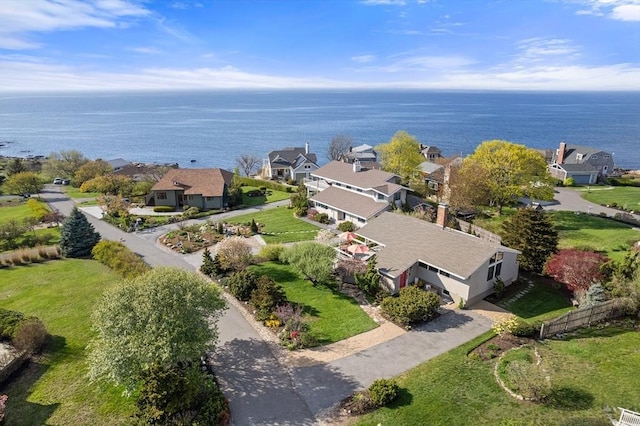 aerial view of residential area with a nearby body of water