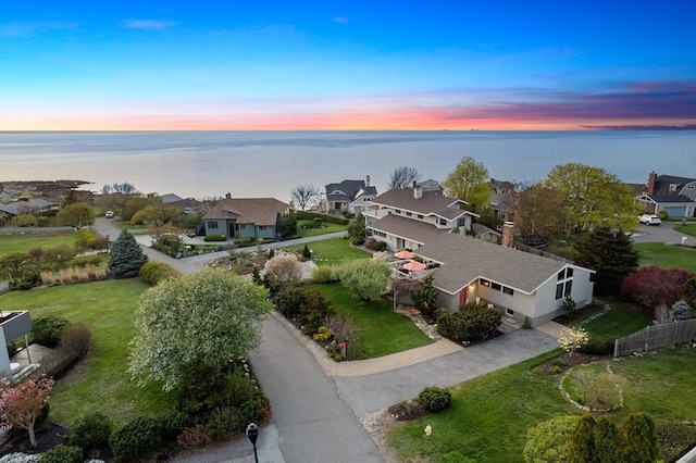 aerial perspective of suburban area featuring a large body of water