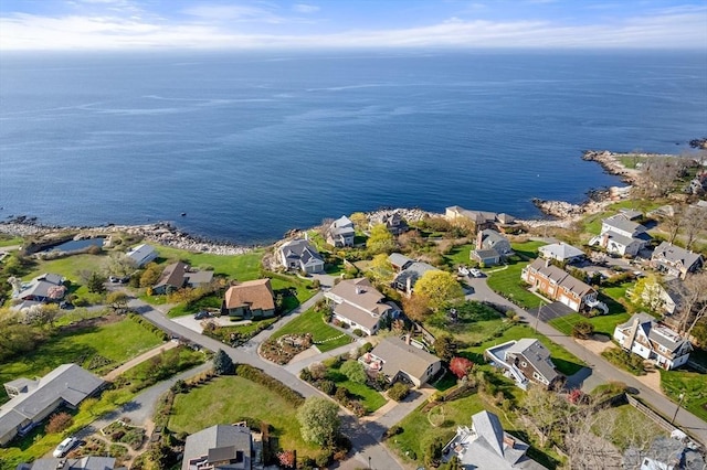 aerial overview of property's location with nearby suburban area and a nearby body of water