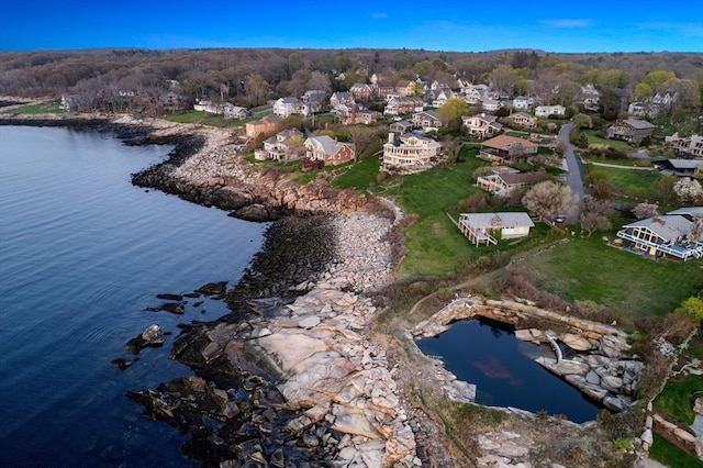 view of property location featuring nearby suburban area and a nearby body of water