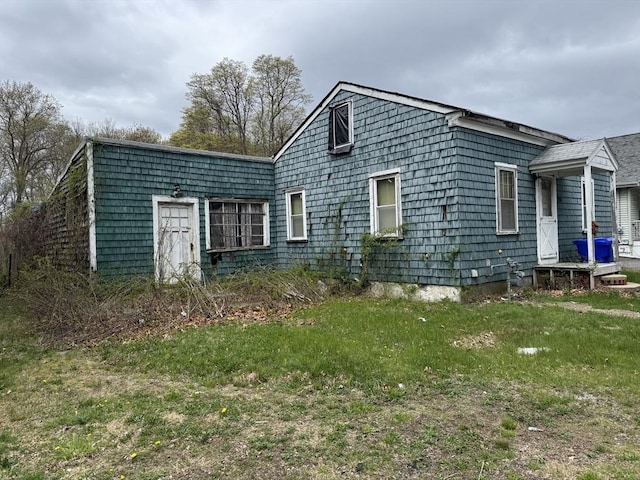 view of home's exterior featuring a yard