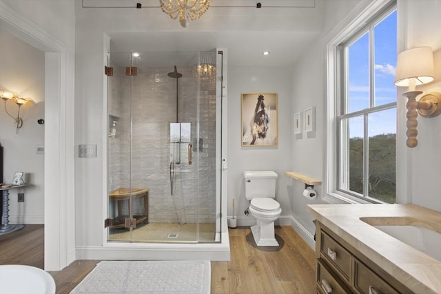 13 Parson Ln, Nantucket, MA 02554 - full bath with baseboards, a stall shower, toilet, and wood finished floors