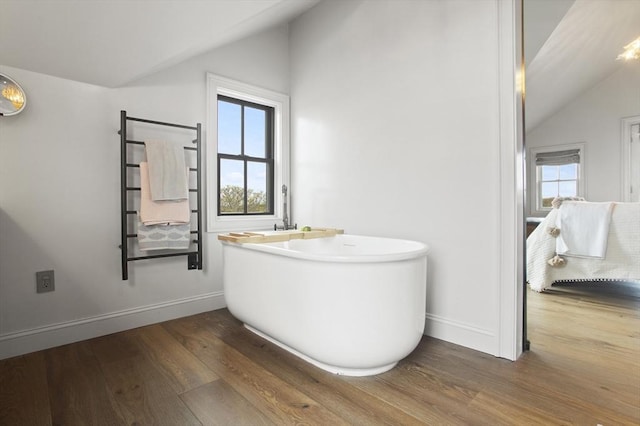 13 Parson Ln, Nantucket, MA 02554 - full bath featuring wood finished floors, baseboards, a freestanding bath, and lofted ceiling
