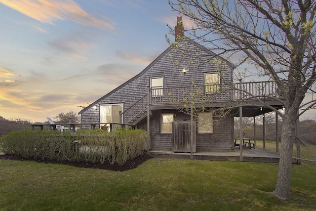 13 Parson Ln, Nantucket, MA 02554 - back of house featuring a lawn, a chimney, a deck, and a patio