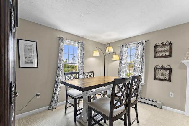31 Wight St, Waltham, MA 02452 - dining space featuring baseboards, a wealth of natural light, baseboard heating, and light colored carpet