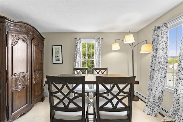 31 Wight St, Waltham, MA 02452 - dining space featuring light colored carpet and a baseboard heating unit