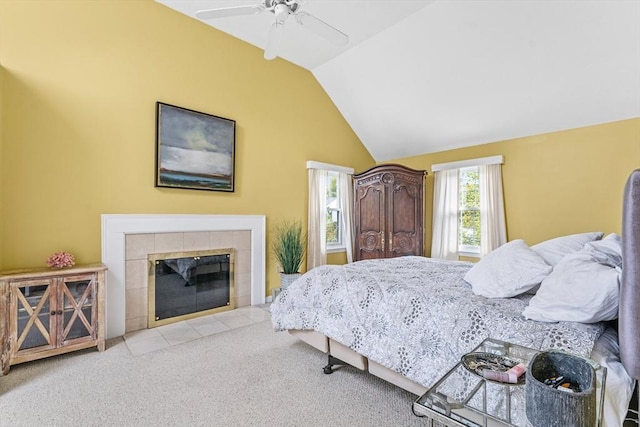 31 Wight St, Waltham, MA 02452 - carpeted bedroom featuring a tiled fireplace, ceiling fan, and lofted ceiling