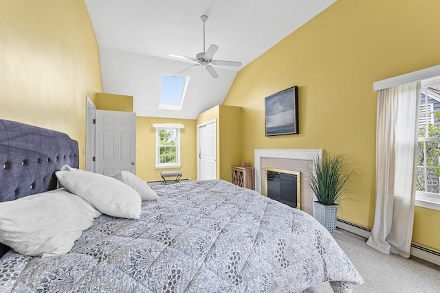 31 Wight St, Waltham, MA 02452 - bedroom featuring a closet, multiple windows, vaulted ceiling with skylight, and a baseboard radiator