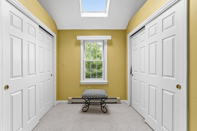 31 Wight St, Waltham, MA 02452 - sitting room featuring a skylight, carpet floors, baseboards, and a baseboard heating unit