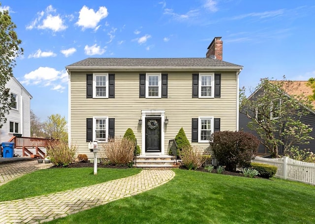 31 Wight St, Waltham, MA 02452 - colonial inspired home featuring fence, a chimney, and a front lawn
