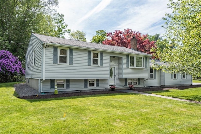 221 Andrew Ln, Hanson, MA 02341 - split foyer home with a chimney and a front lawn