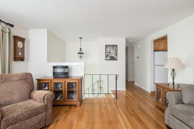 221 Andrew Ln, Hanson, MA 02341 - sitting room featuring an upstairs landing and light wood-type flooring