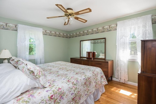 221 Andrew Ln, Hanson, MA 02341 - bedroom with light wood-style floors and ceiling fan