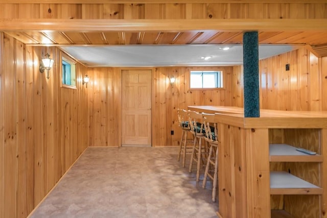 221 Andrew Ln, Hanson, MA 02341 - below grade area featuring wood walls and a bar