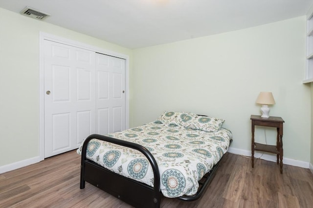 221 Andrew Ln, Hanson, MA 02341 - bedroom with wood finished floors and a closet