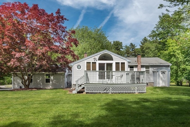 221 Andrew Ln, Hanson, MA 02341 - back of house with a chimney, a wooden deck, and a lawn