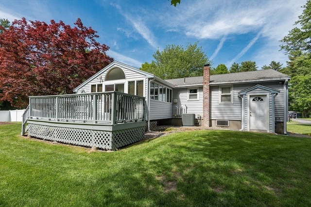 221 Andrew Ln, Hanson, MA 02341 - rear view of house with a wooden deck, a chimney, and a lawn