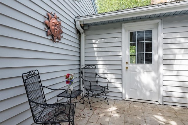 221 Andrew Ln, Hanson, MA 02341 - doorway to property featuring a patio area