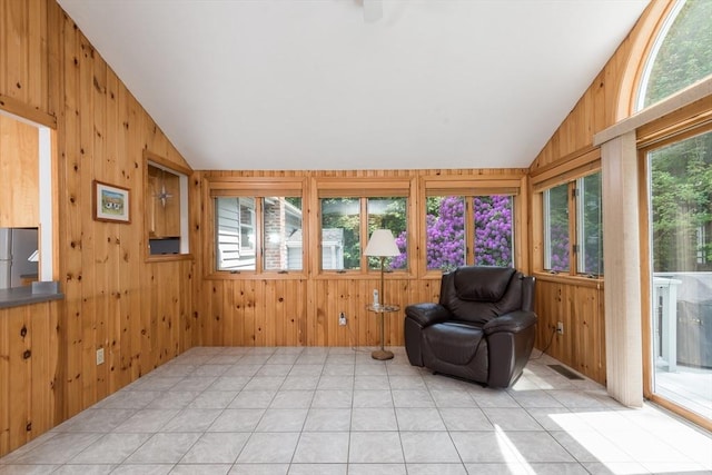 221 Andrew Ln, Hanson, MA 02341 - unfurnished room featuring vaulted ceiling, wood walls, and light tile patterned floors