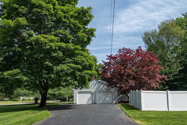 221 Andrew Ln, Hanson, MA 02341 - view of front of home with an outbuilding, a chimney, and driveway