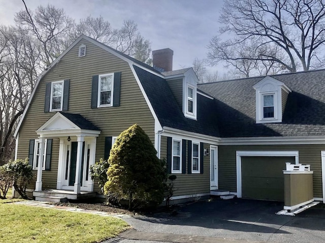 cape cod house with a garage