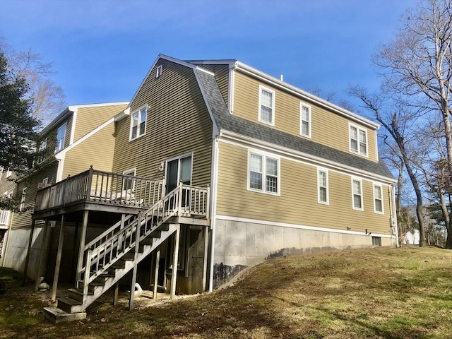 rear view of property with a wooden deck