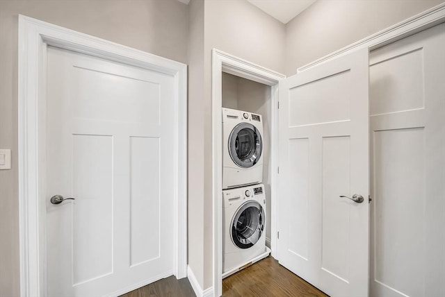 966 Hyde Park Ave Unit 301, Boston, MA 02136 - washroom with stacked washing machine and dryer, dark wood-style flooring, and baseboards