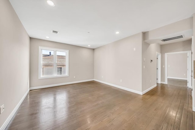 966 Hyde Park Ave Unit 301, Boston, MA 02136 - empty room with wood finished floors, baseboards, and recessed lighting